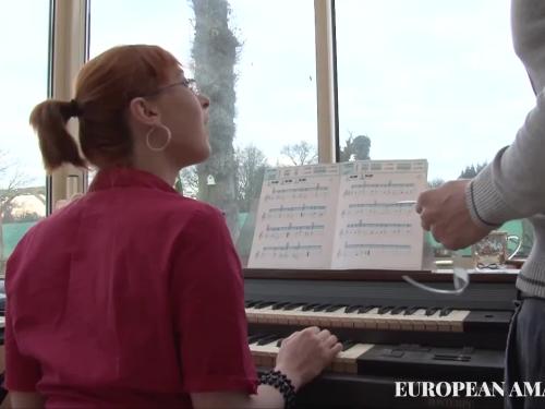 The music instructing how to play with the piano into the girl student instructs her to take action in addition to instructor